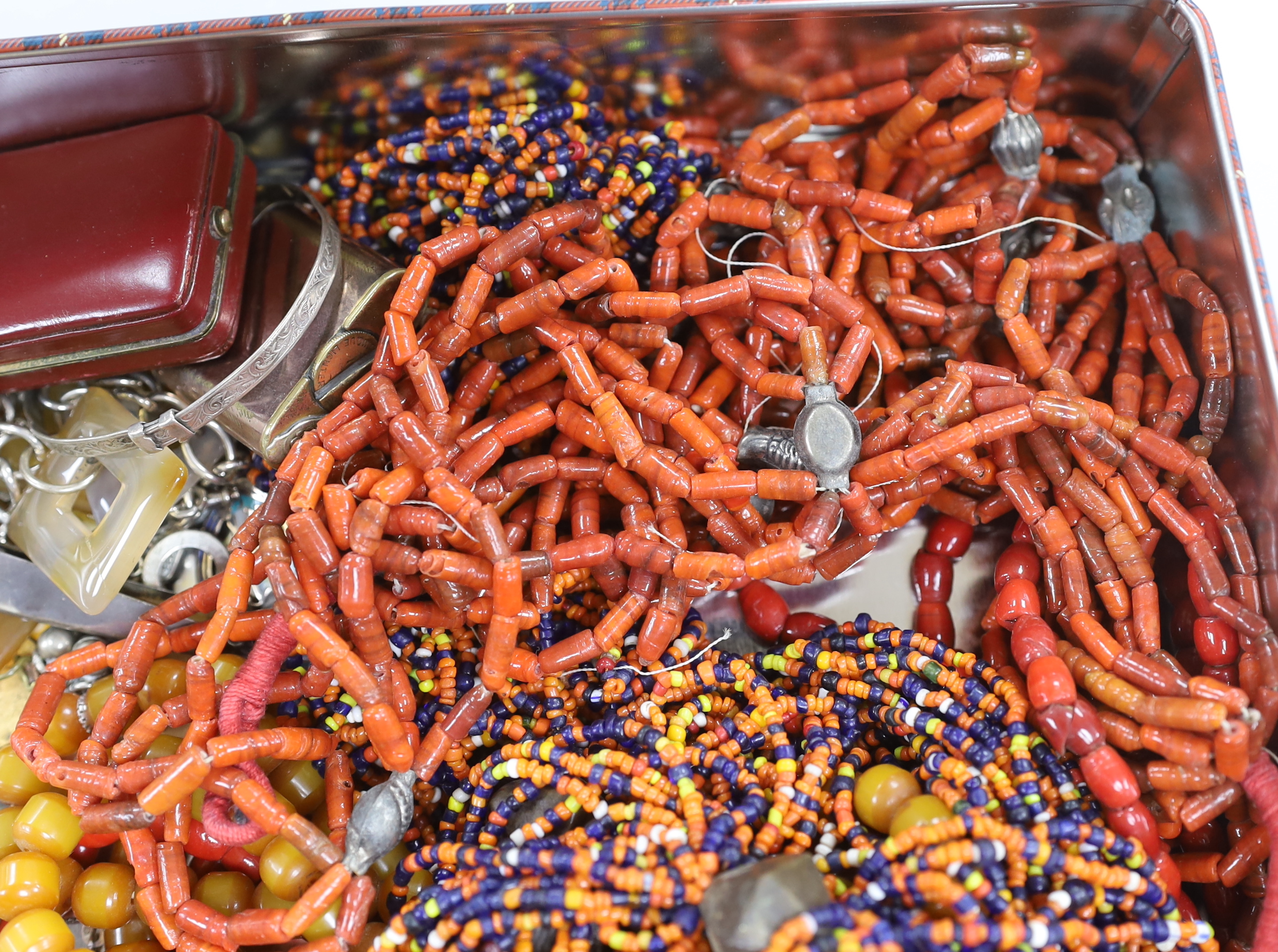 A group of assorted costume jewellery, including an orange zircon? ring.